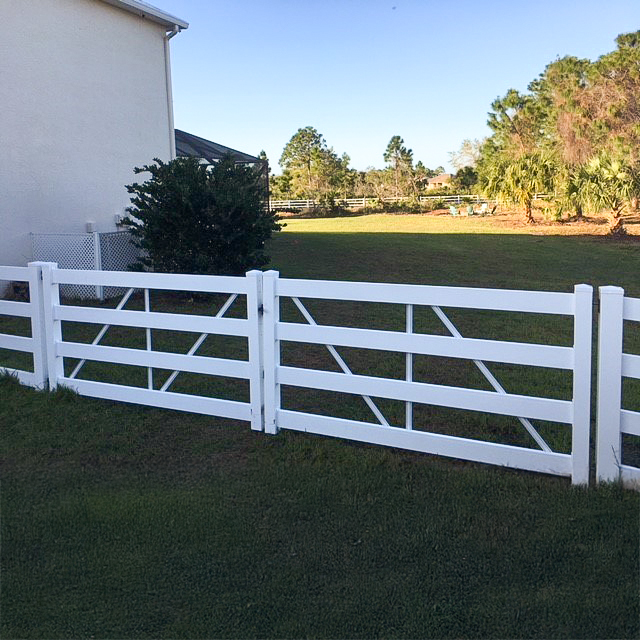 A double gate outside a pasture.