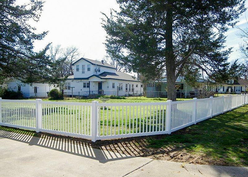 closed-top-picket-2 A closed top picket fence surrounds a large yard and home.