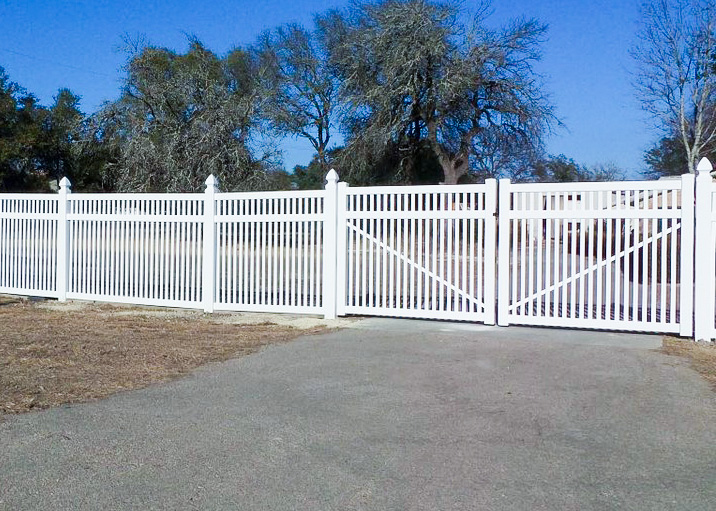 closed-top-picket-3 A closed top picket fence with a gate and gothic caps.