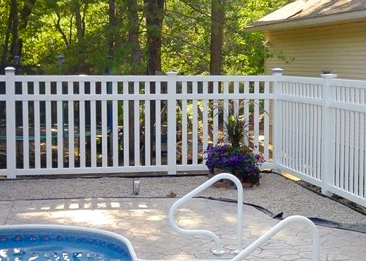 pool-fence-3 a pool fence protects an outdoor swimming pool.