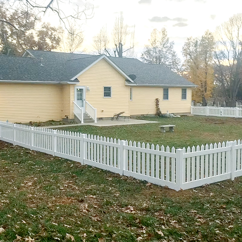 straight-picket-fence A backyard surrounded in a straight picket fence.