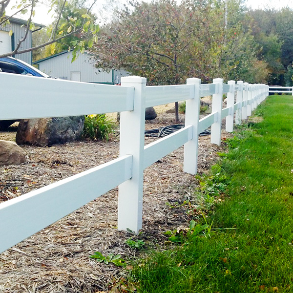 two-rail-horse-fence A two rail horse fence bordering a yard.